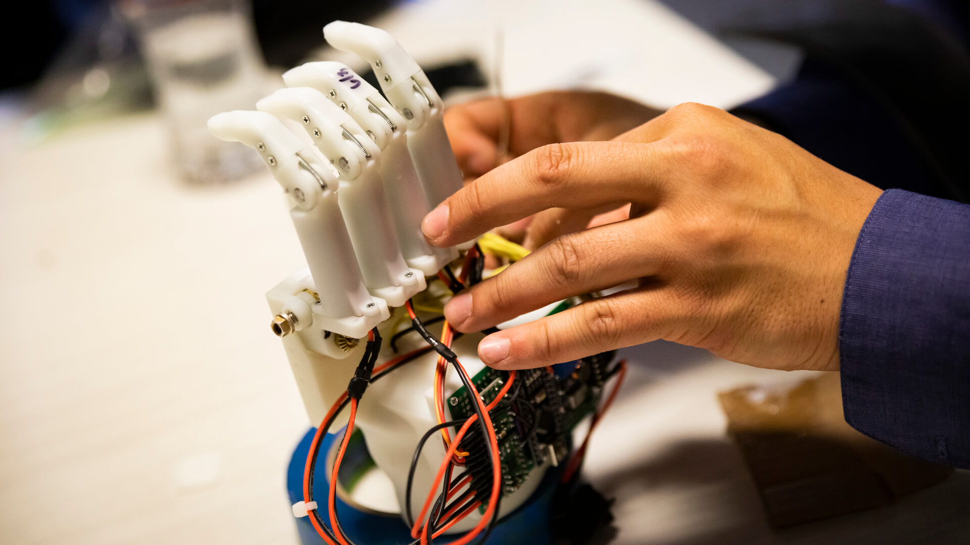 Cal Poly engineering students created two prosthetic hands for 10-year-old Julian Reynoso, who lost part of his hands in a car accident